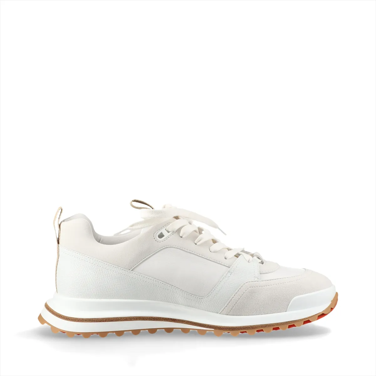 White leather low-top footwear with grey panelling, photographed from the side