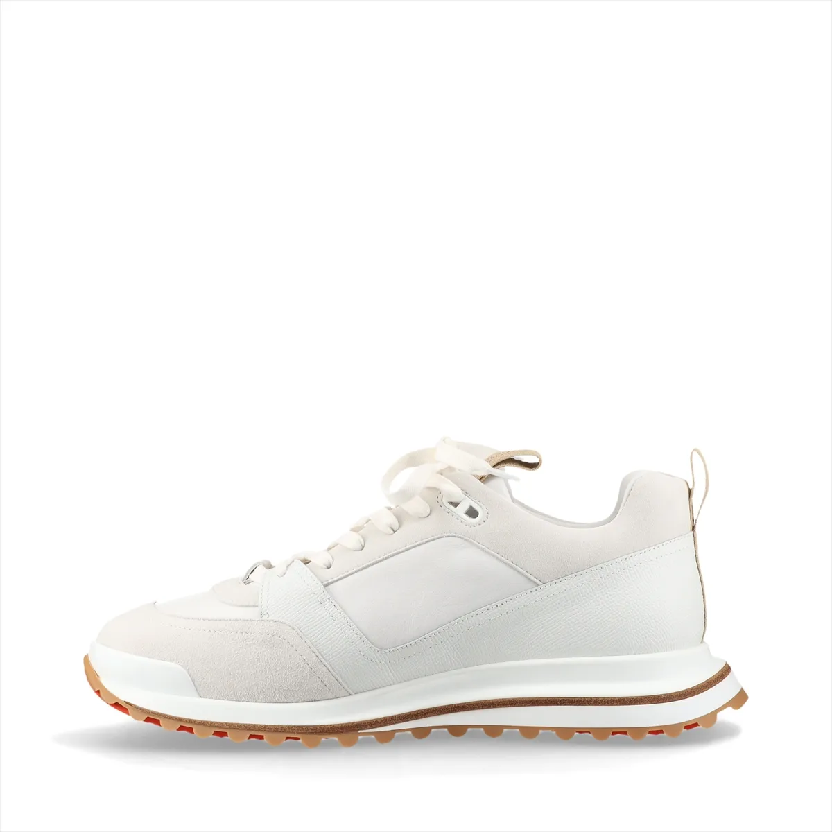 White leather low-top footwear with grey panelling, photographed from the side