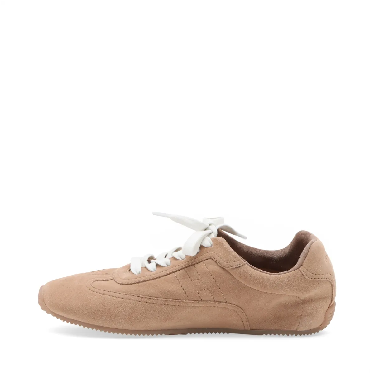 Beige suede low-top sneakers with white soles, side view.