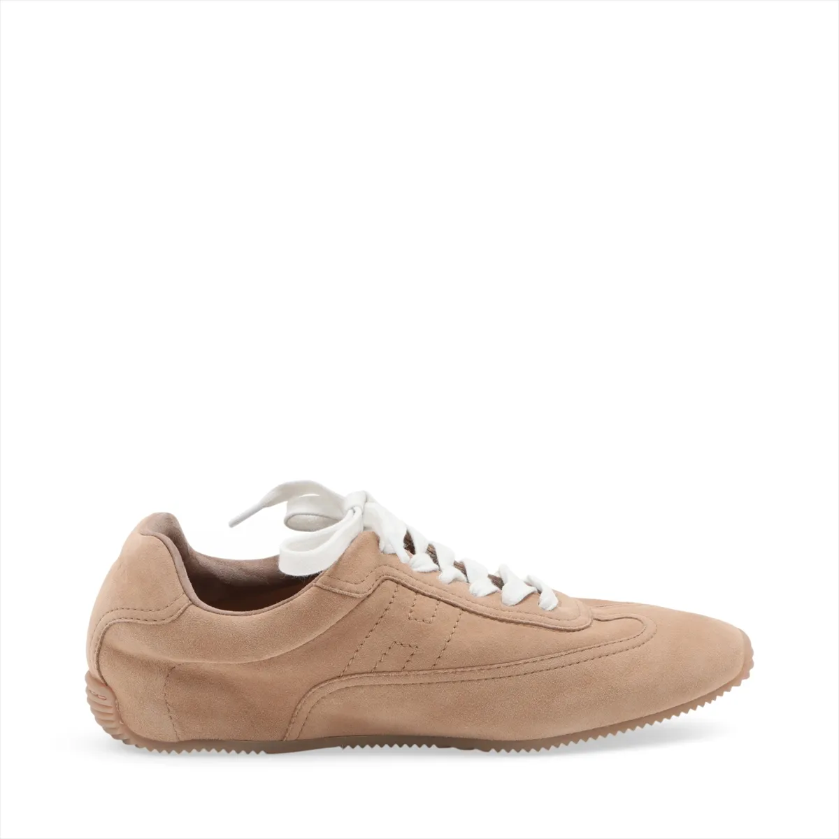 Beige suede low-top sneakers with white soles, side view.