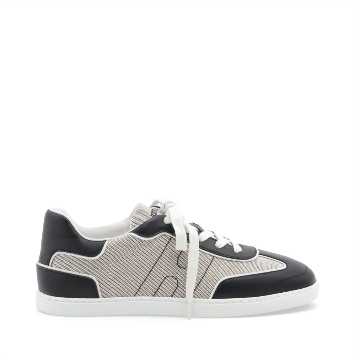 Black and grey low-top lace-up sneakers with white sole, photographed from the side.