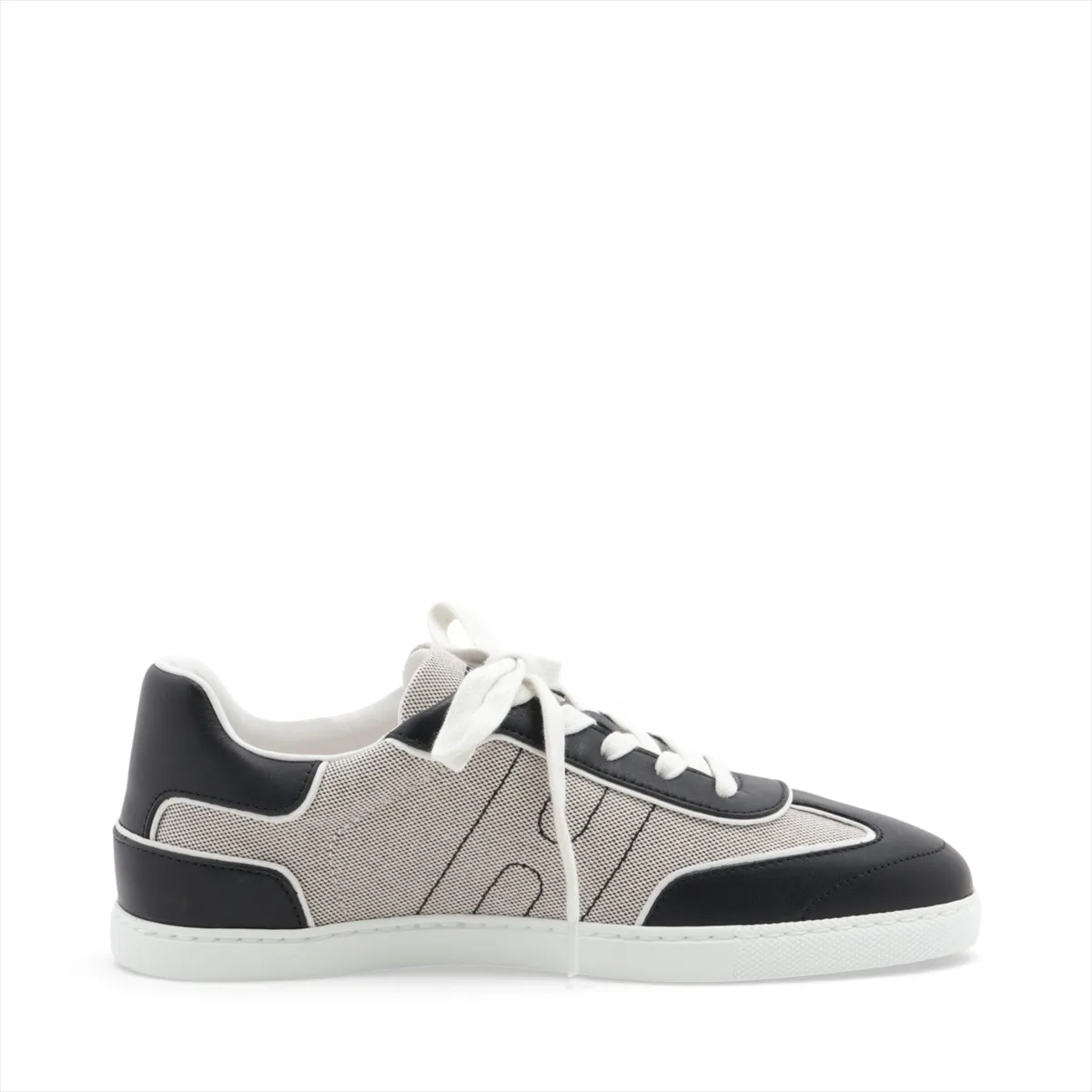 Black and grey low-top lace-up sneakers with white sole, photographed from the side.