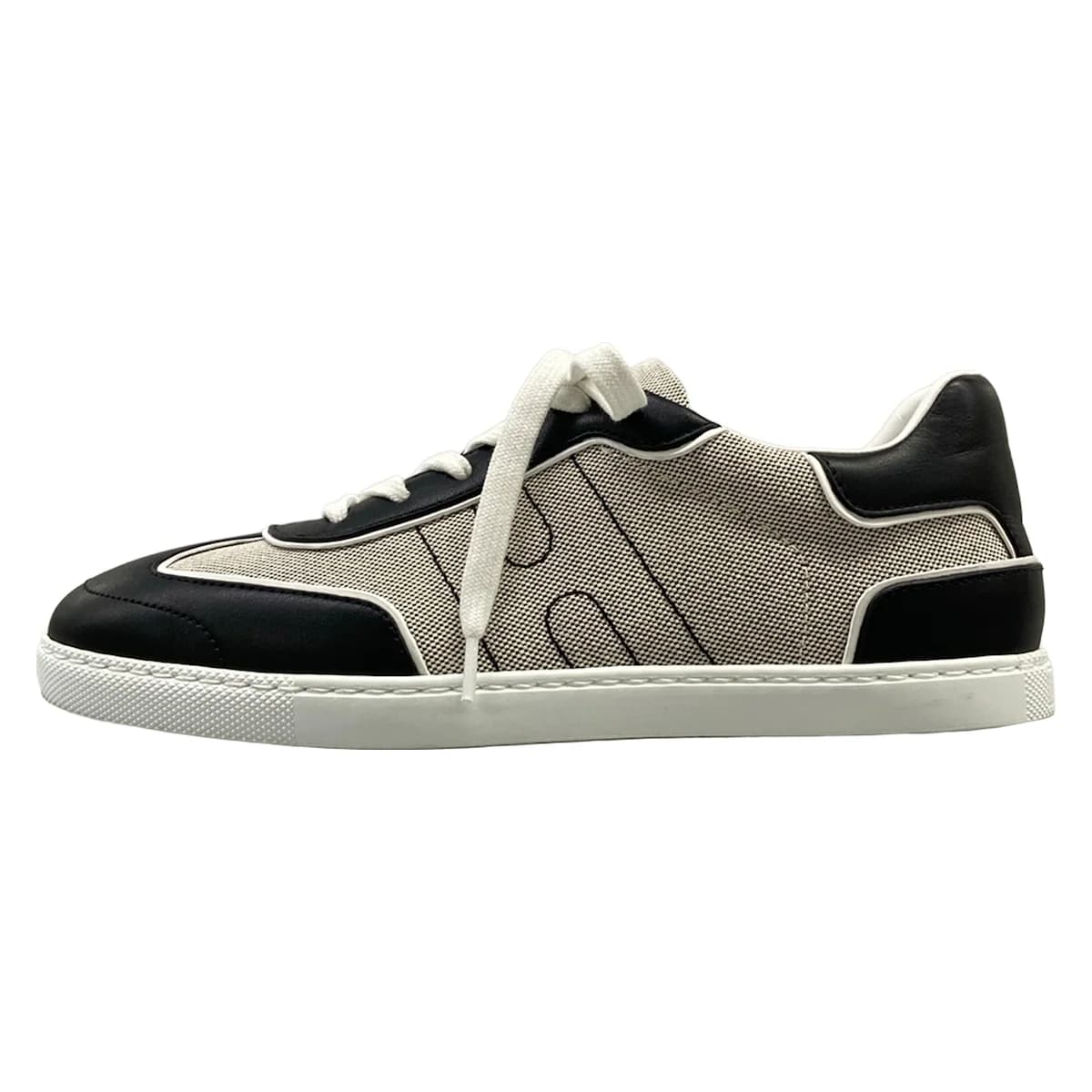 Pair of low-top sneakers photographed from the side.