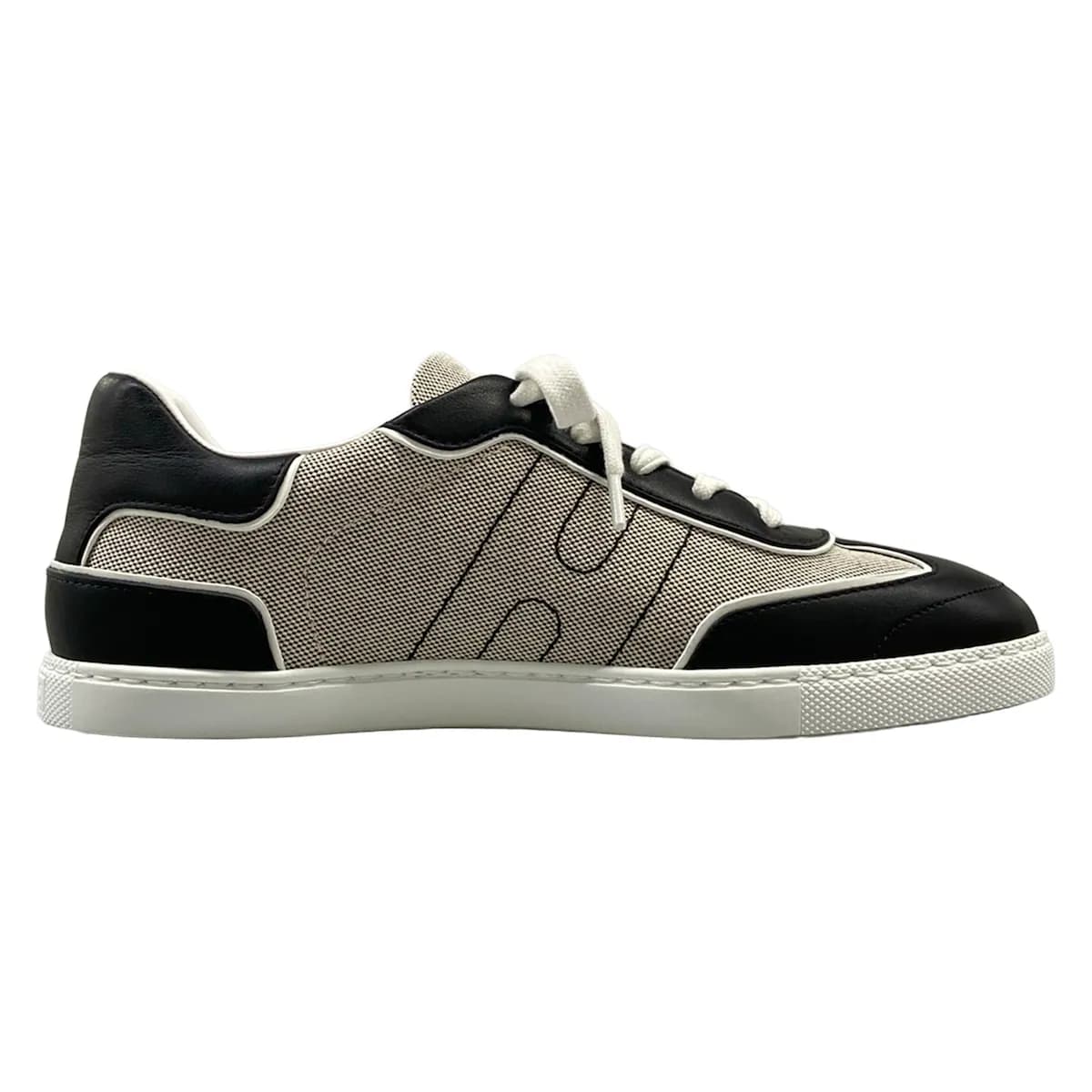 Pair of low-top sneakers photographed from the side.