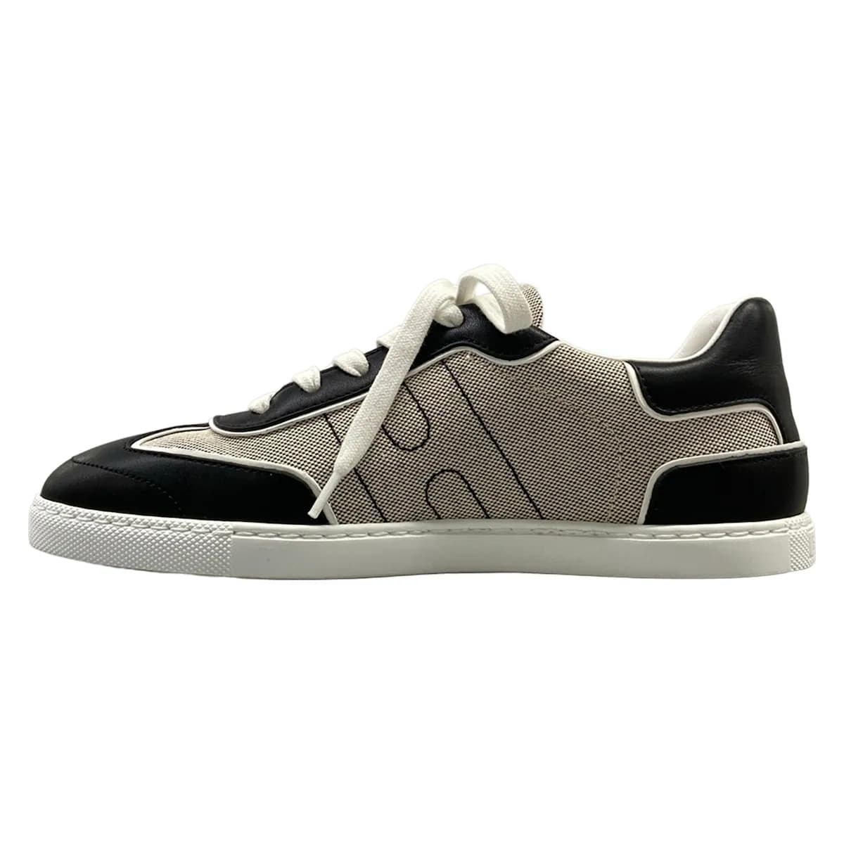 Pair of low-top sneakers photographed from the side.