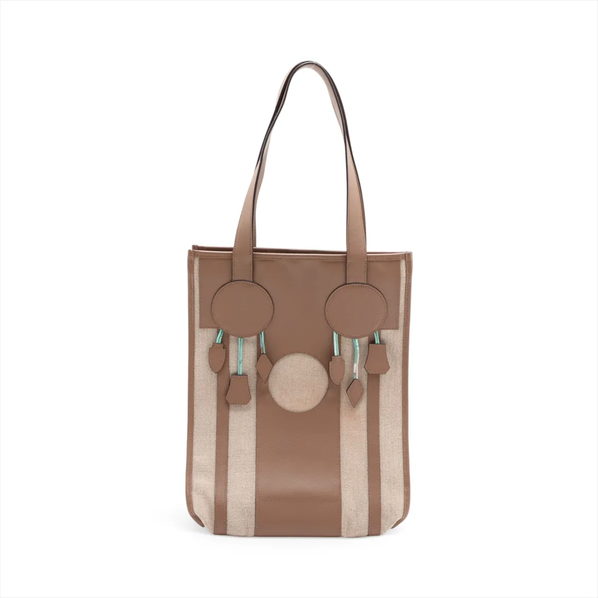 Beige canvas bag with taupe leather trim and a decorative dreamcatcher motif.