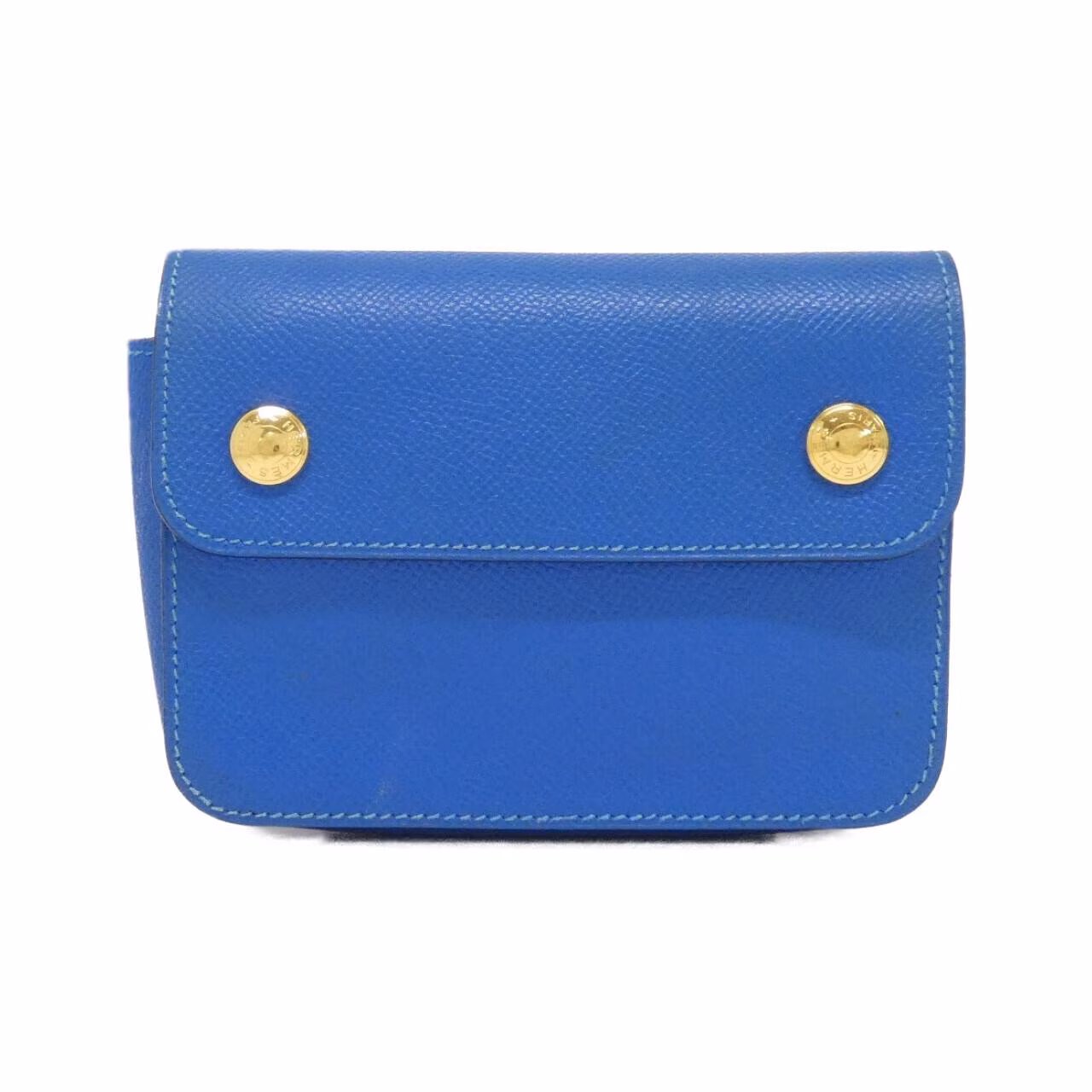 Small green belt bag with buckled strap.