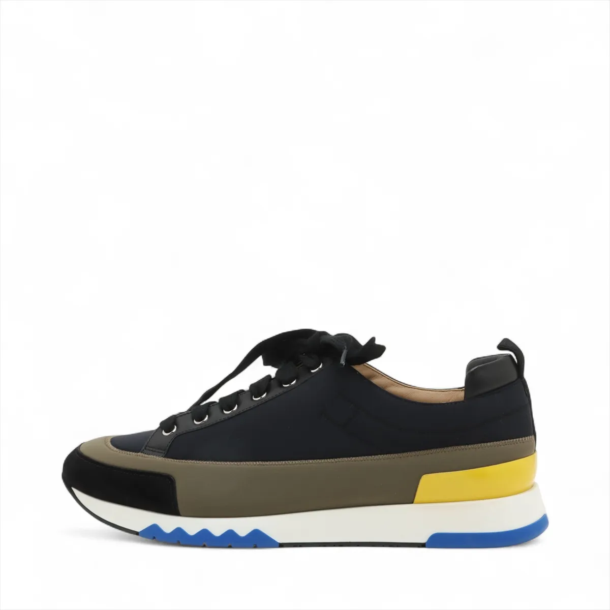 Black and khaki fabric low-top sneaker with contrast panels and a white sole.