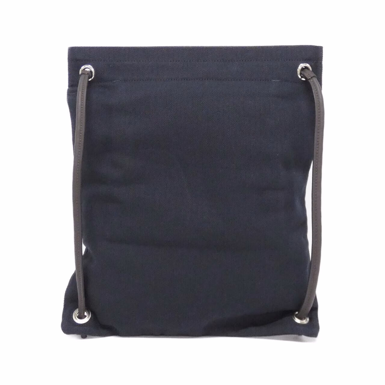 Shoulder bag with a long strap photographed against a plain background.