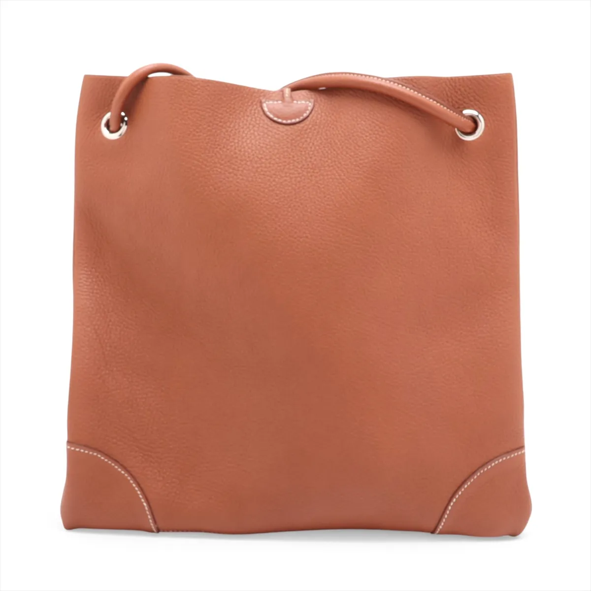 Tan leather shoulder bag with a flap front, canvas-lined body and silver hardware.