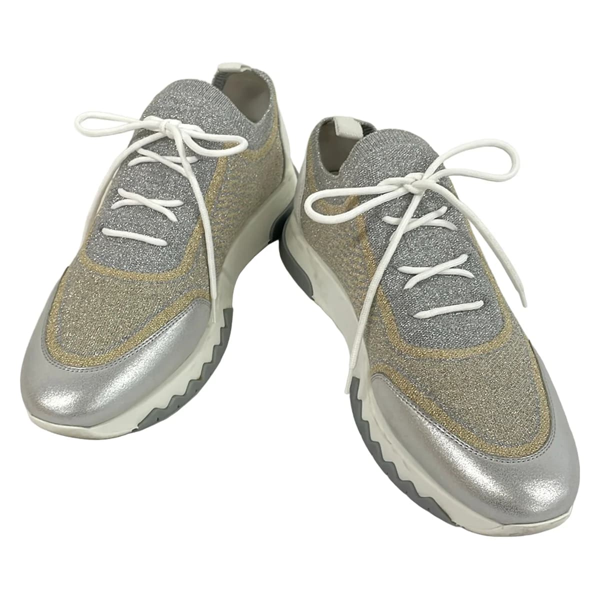Low-top sneakers in white with metallic silver and gold panels.