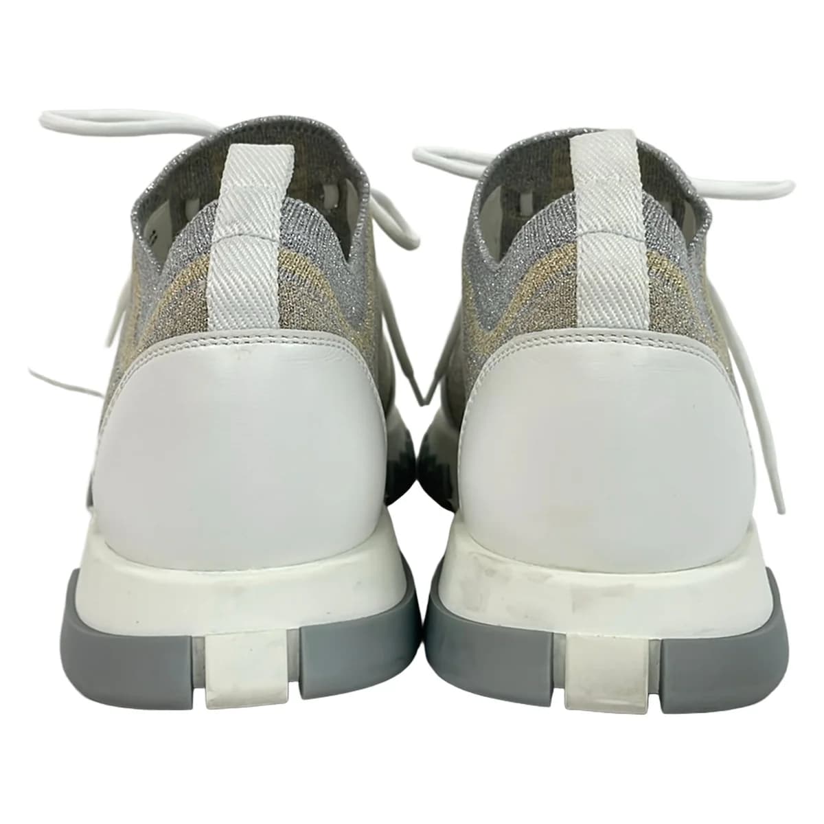 Low-top sneakers in white with metallic silver and gold panels.