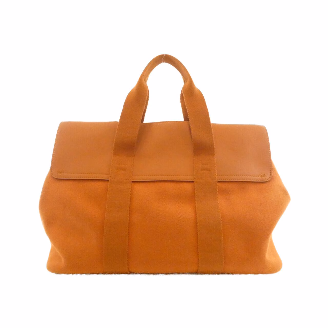 Rounded canvas and leather handbag with zip top and short handles.