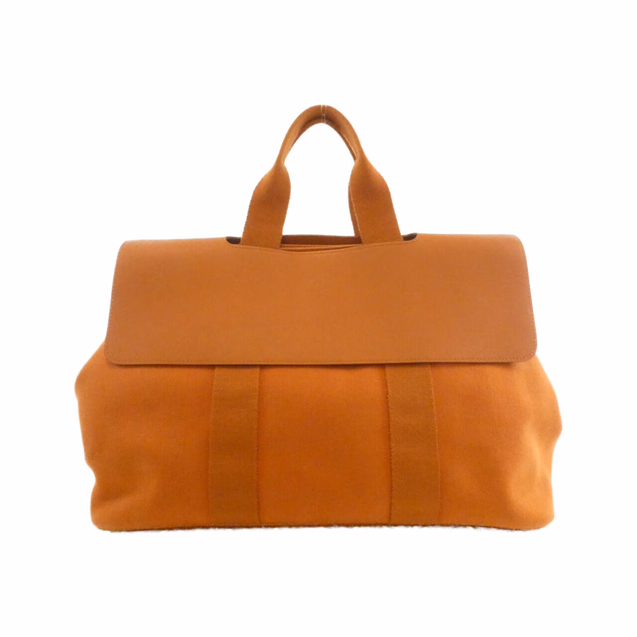 Rounded canvas and leather handbag with zip top and short handles.