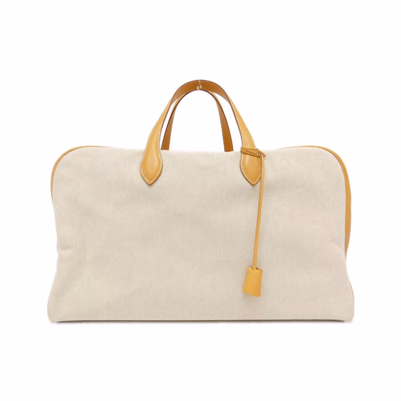 Wide duffel-shaped leather travel bag with twin handles and zip top.
