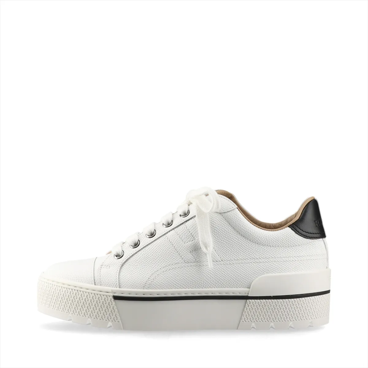 White leather platform sneakers with black trim and a chunky sole.