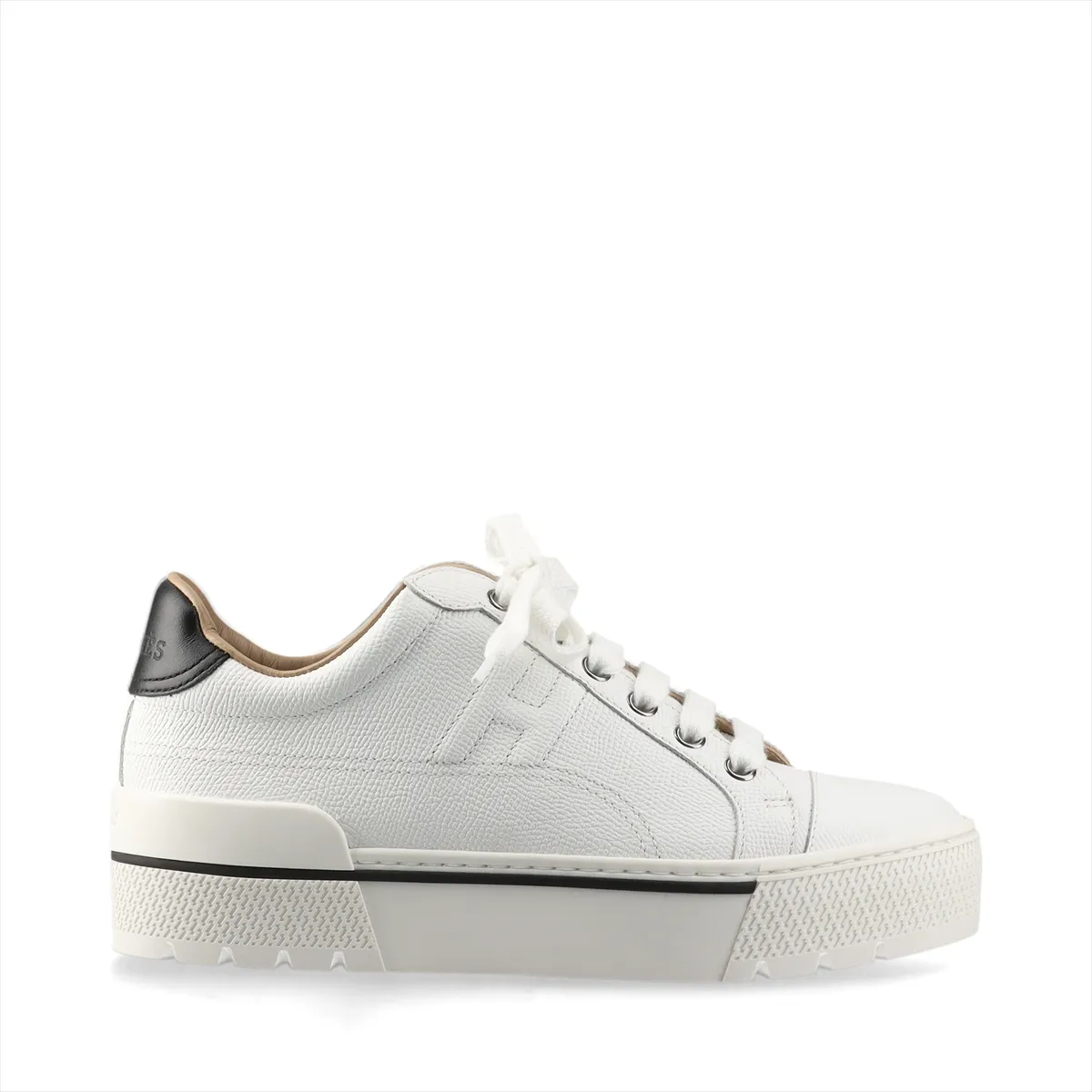 White leather platform sneakers with black trim and a chunky sole.