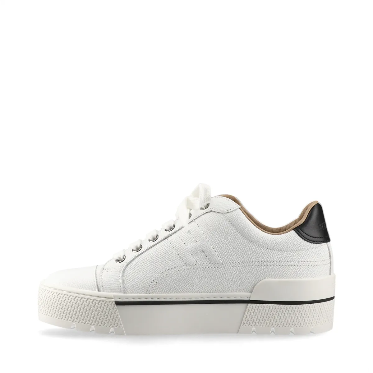 White leather platform sneakers with black trim and a chunky sole.