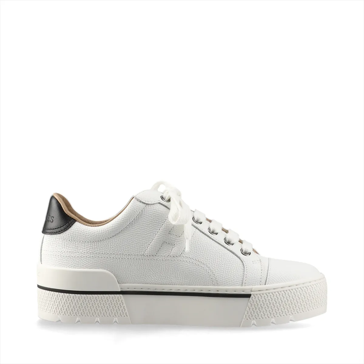 White leather platform sneakers with black trim and a chunky sole.