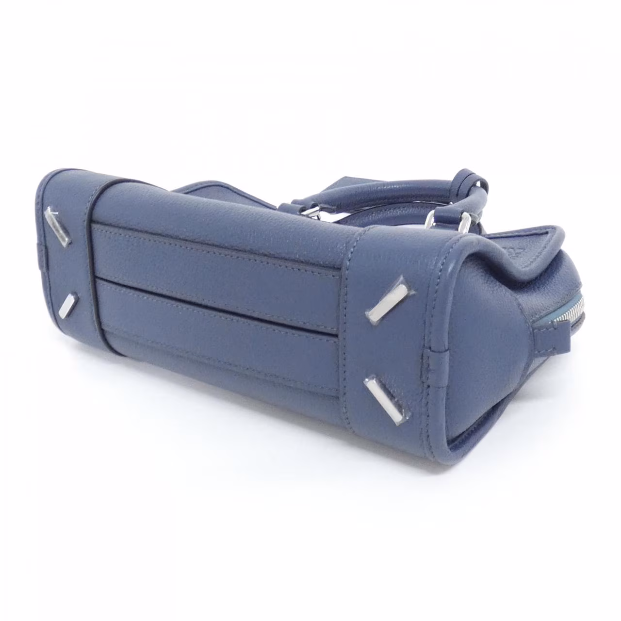 Structured handbag with short rolled handles and a top zip closure
