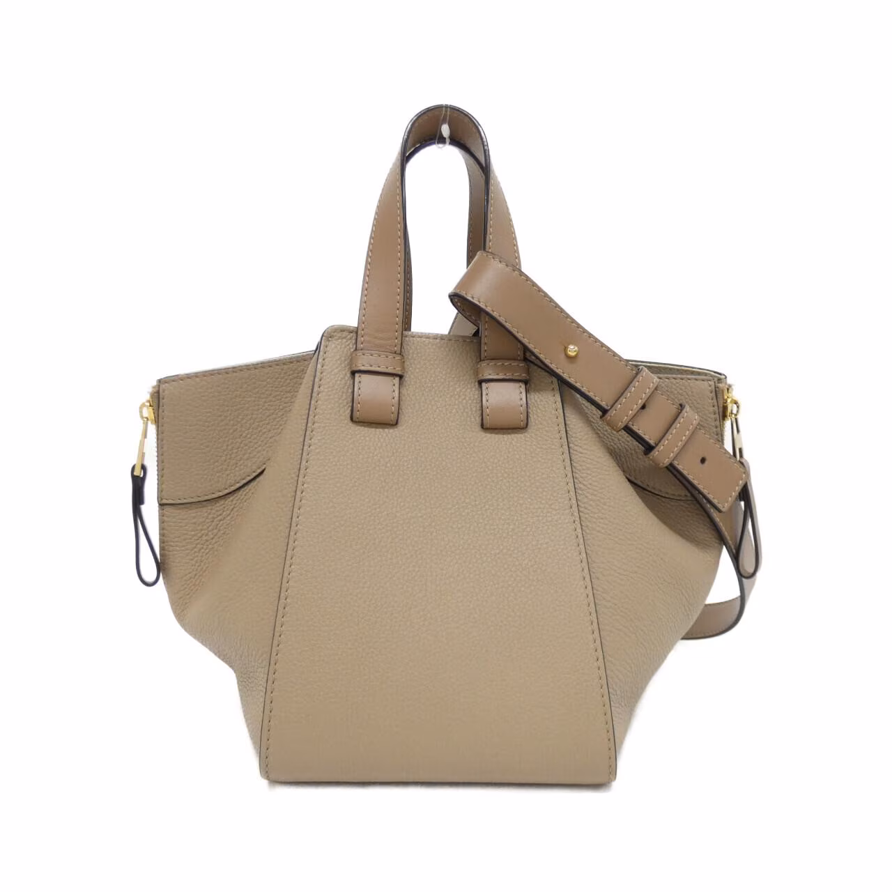 Compact leather bag with winged sides, top handle and detachable shoulder strap
