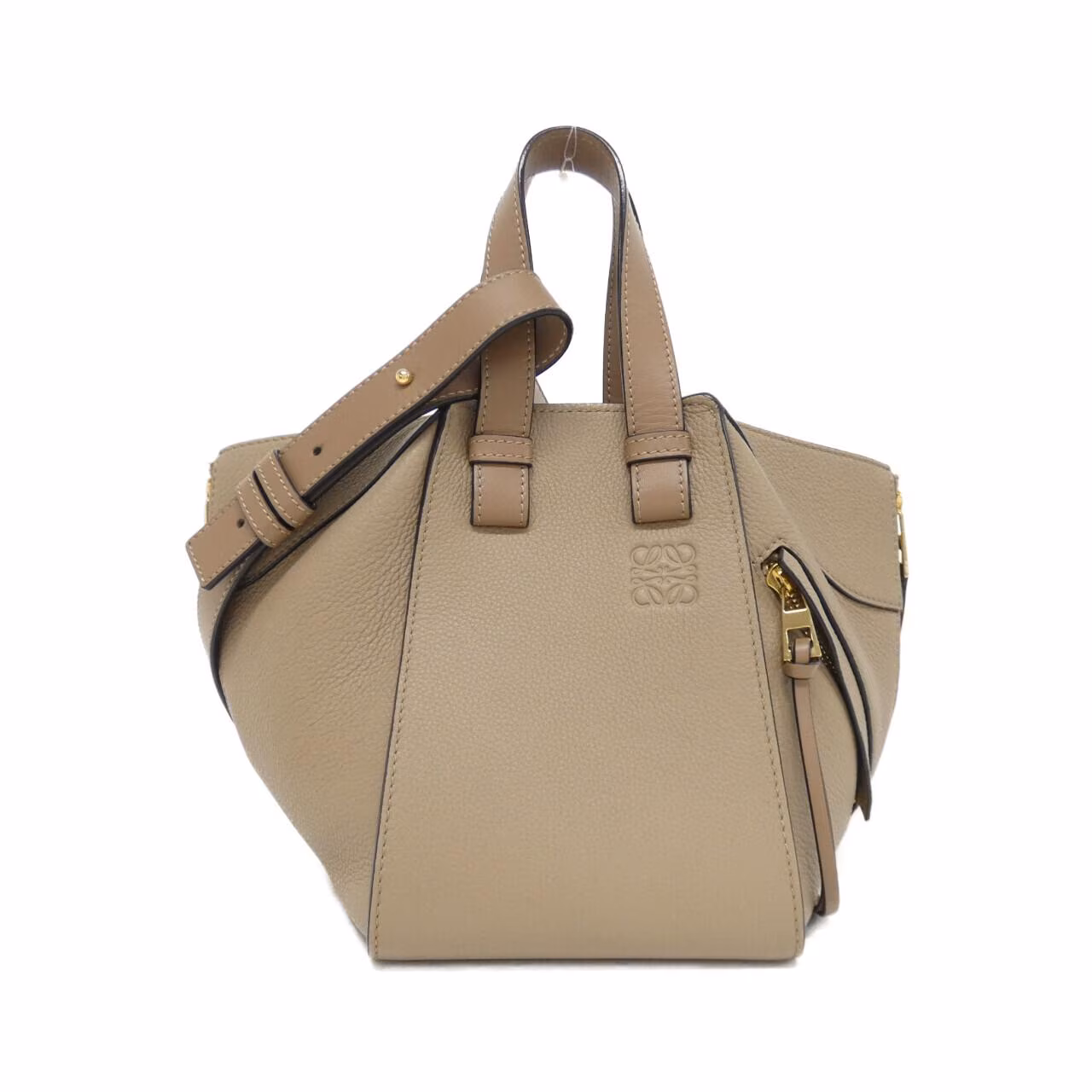 Compact leather bag with winged sides, top handle and detachable shoulder strap