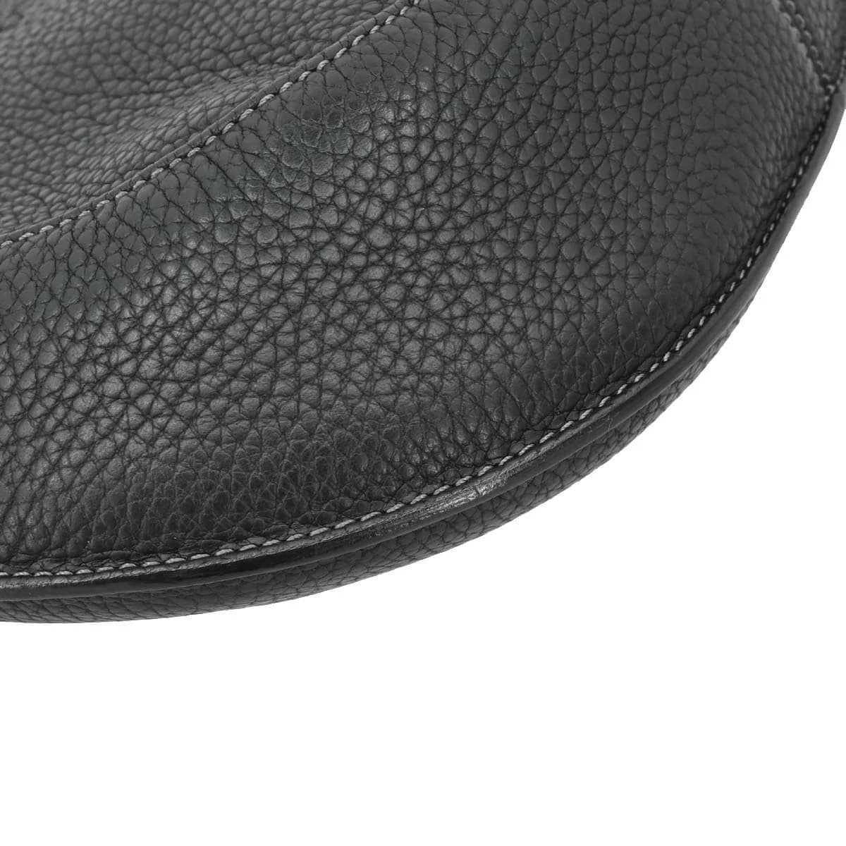 Slouchy black leather shoulder bag with a single strap.