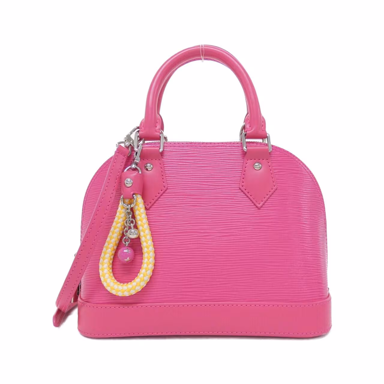 Small dome-shaped handbag in textured leather with short handles and a shoulder strap.