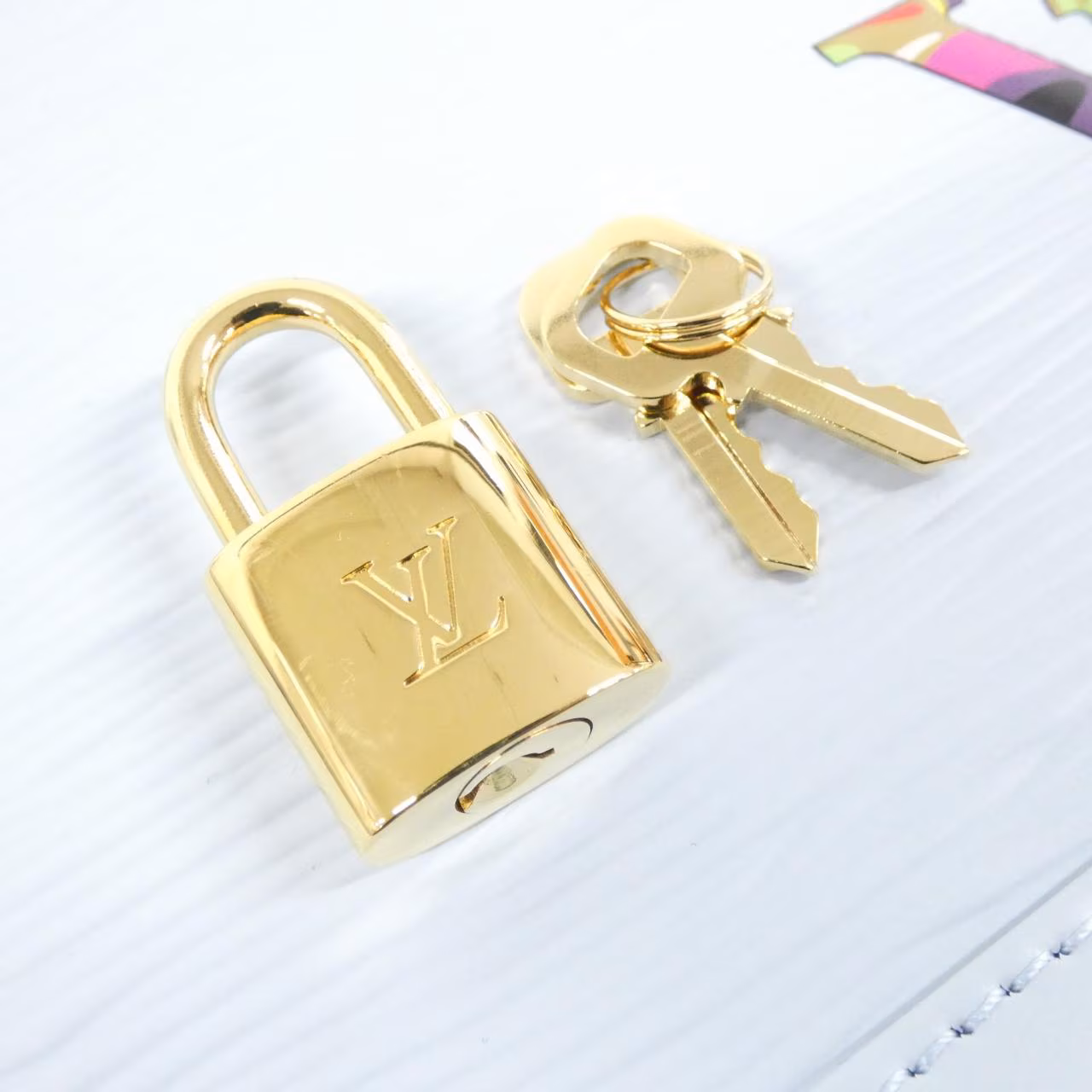 Compact dome-shaped leather handbag with rounded top handles and a zip closure.