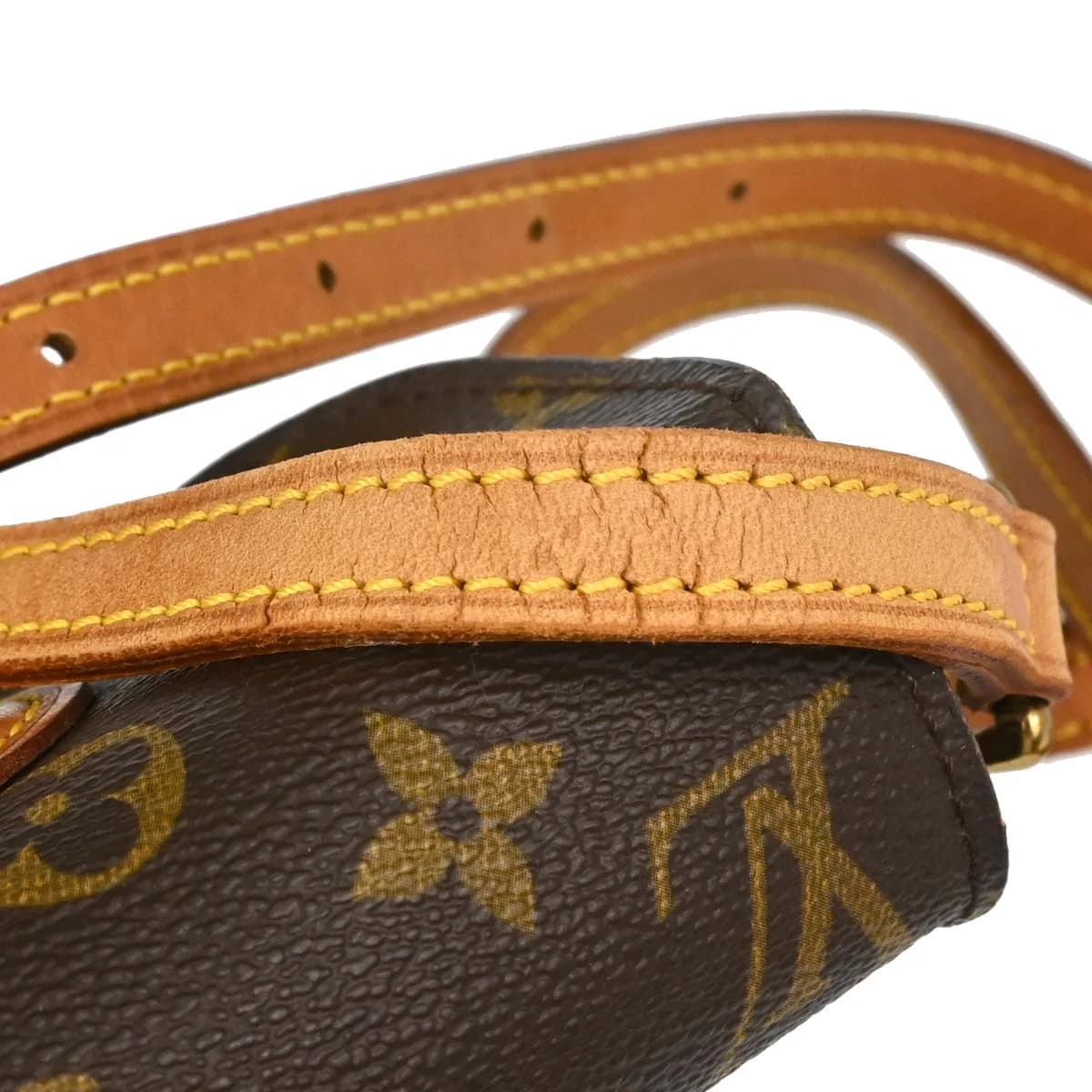 Small brown monogram canvas flap bag with leather trim and a thin adjustable shoulder strap