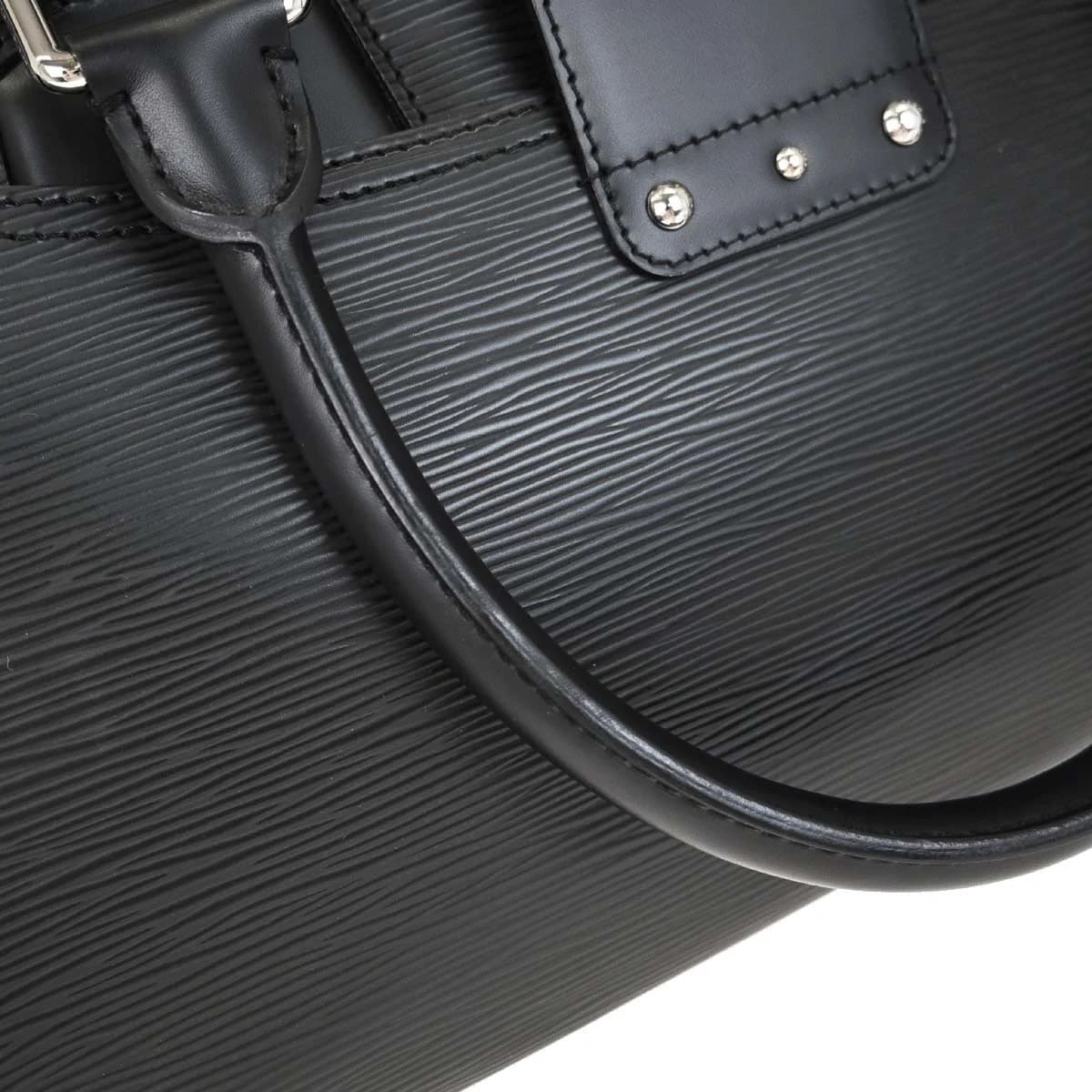 Structured black textured-leather bowling-style bag with rolled handles.