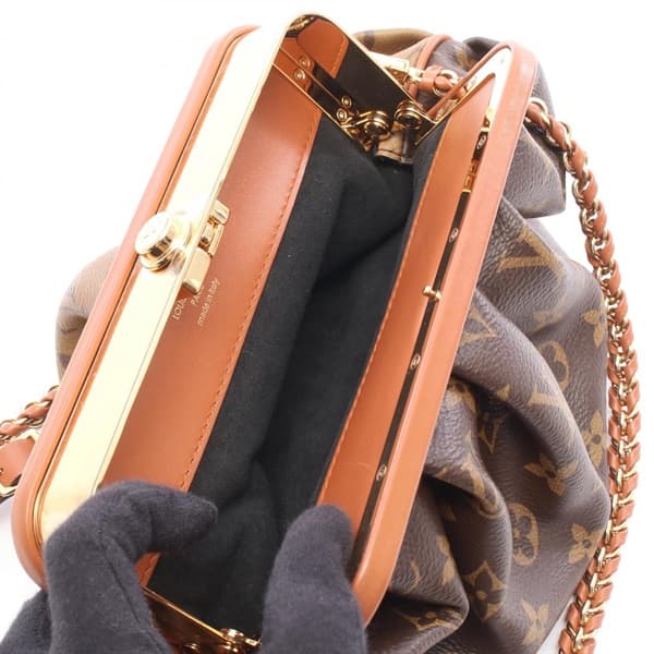 Brown monogram-pattern coated canvas east-west shoulder bag with leather trim and a detachable strap.