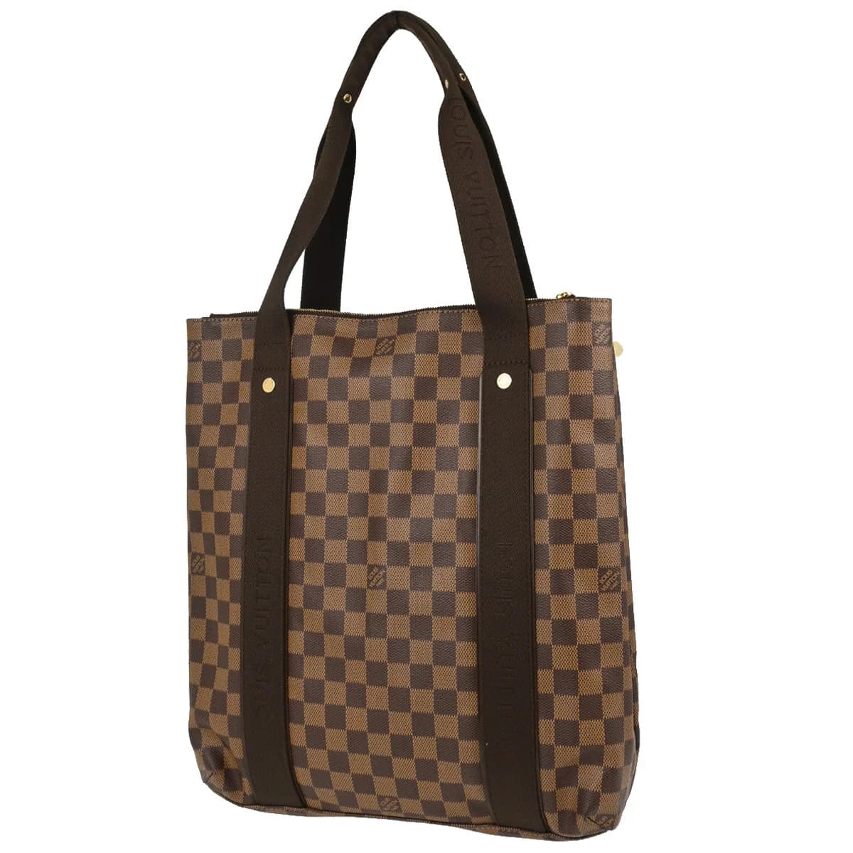Brown checked canvas tote bag with tan leather handles and trim, standing upright.