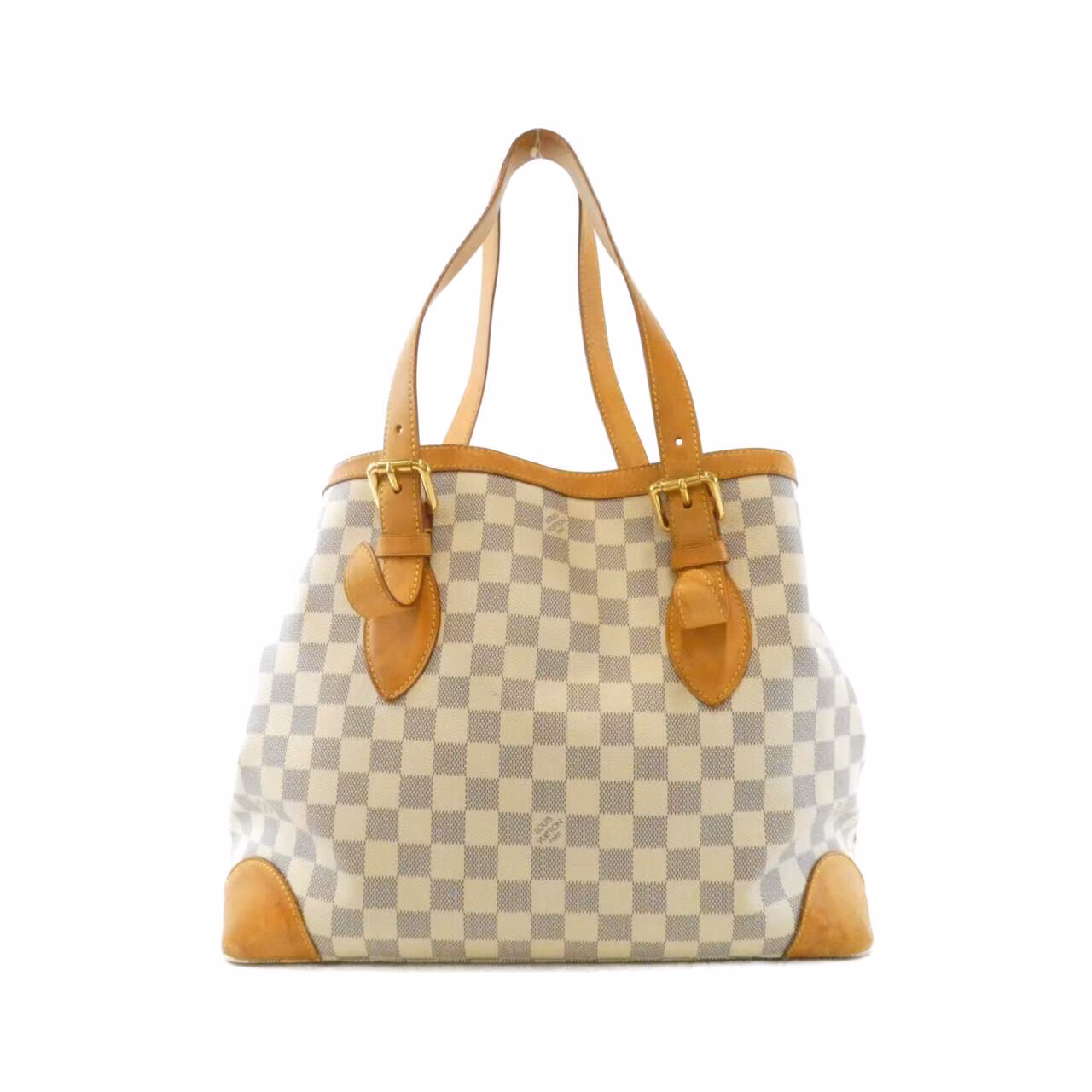 Light blue and white checked canvas shoulder bag with tan leather handles.