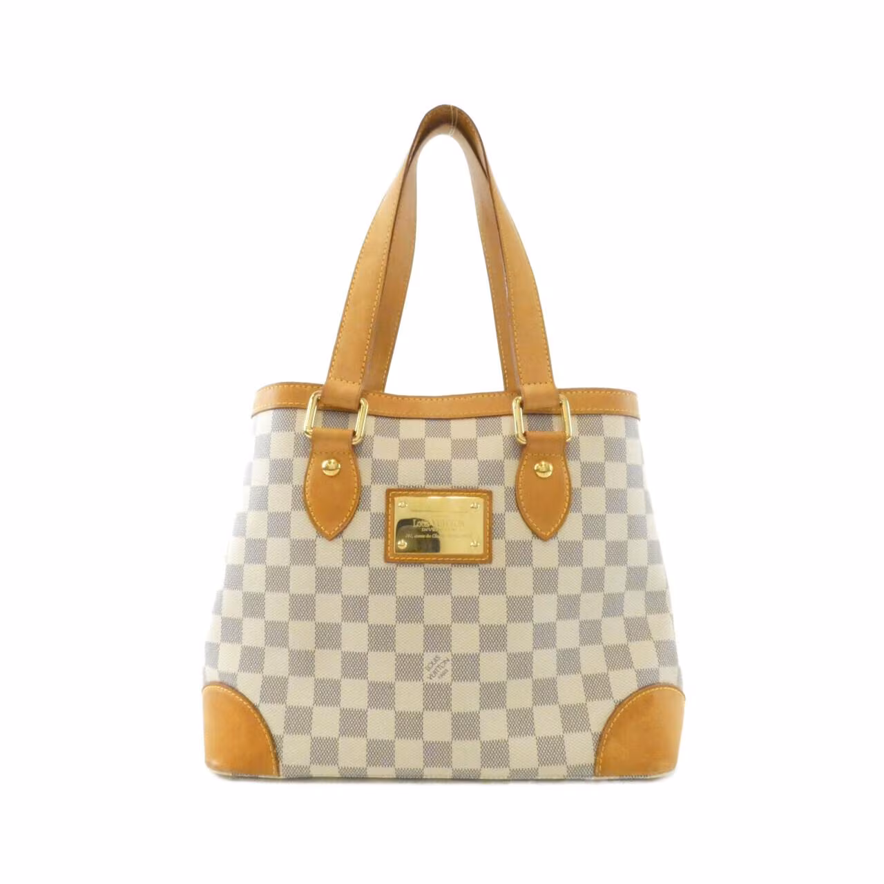 Compact checked canvas shoulder bag in pale blue and white with tan leather straps.