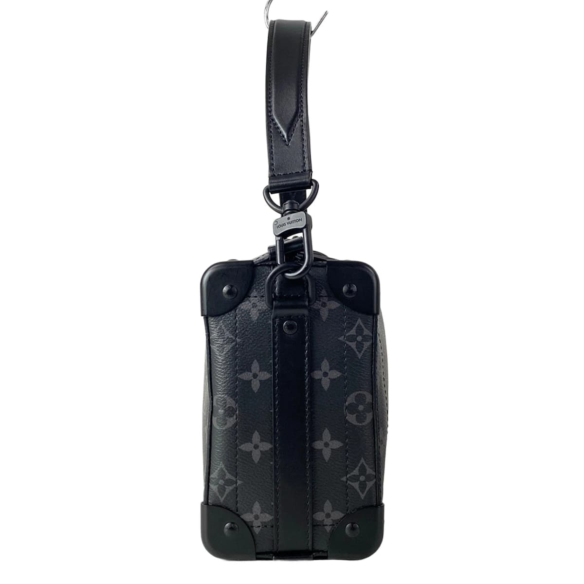 Grey and black patterned canvas bag with dark trim, shown against a plain backdrop