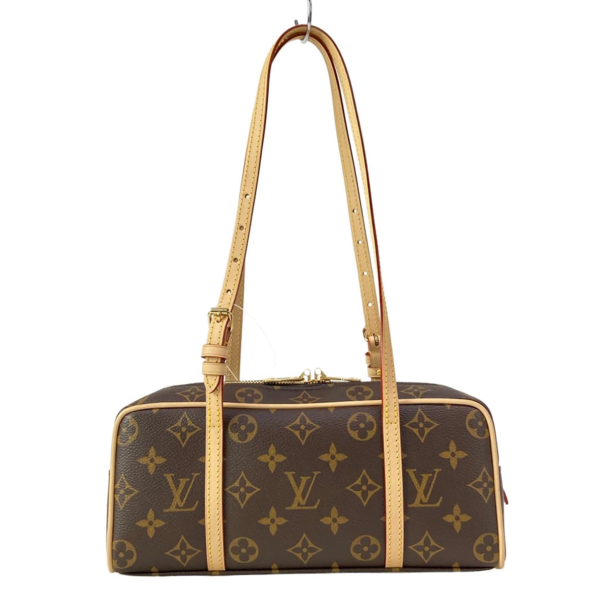 Compact patterned canvas shoulder bag with a flap front and slim strap