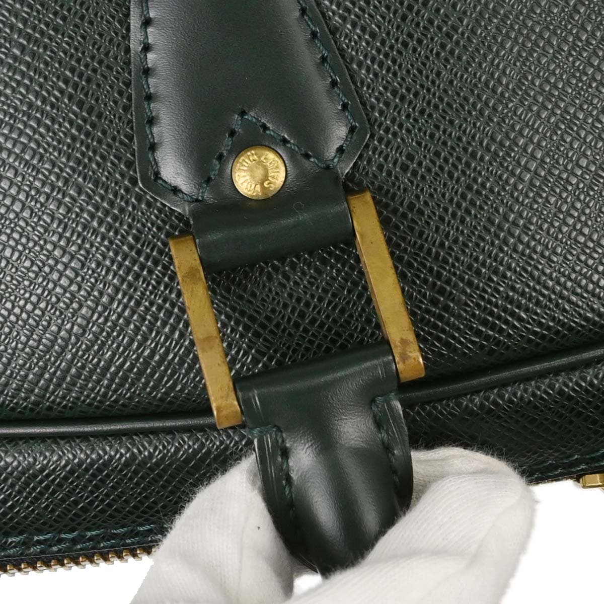 Dark green grained leather travel holdall with twin handles and a zip top
