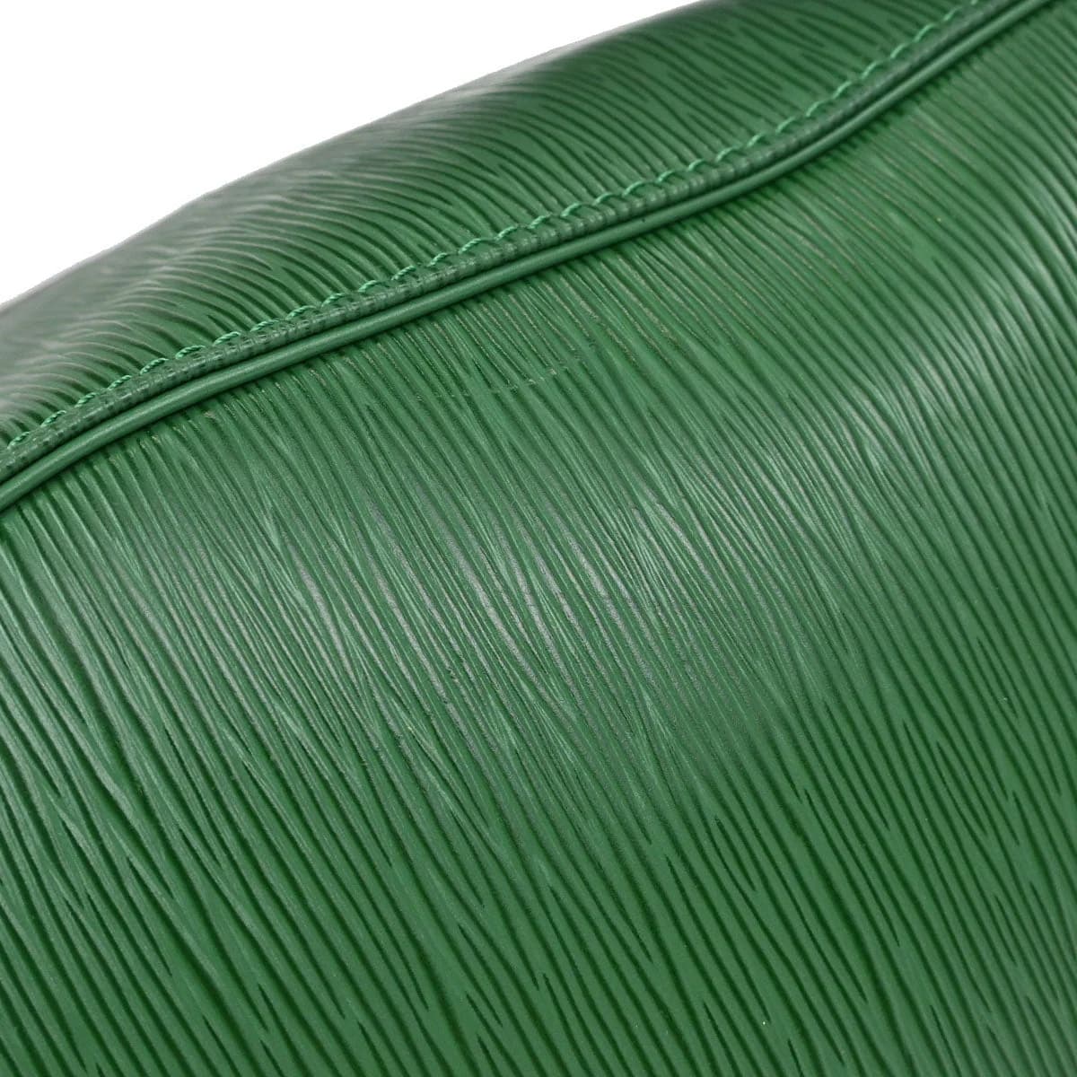 Green textured leather duffle bag with twin handles and a long zip closure.