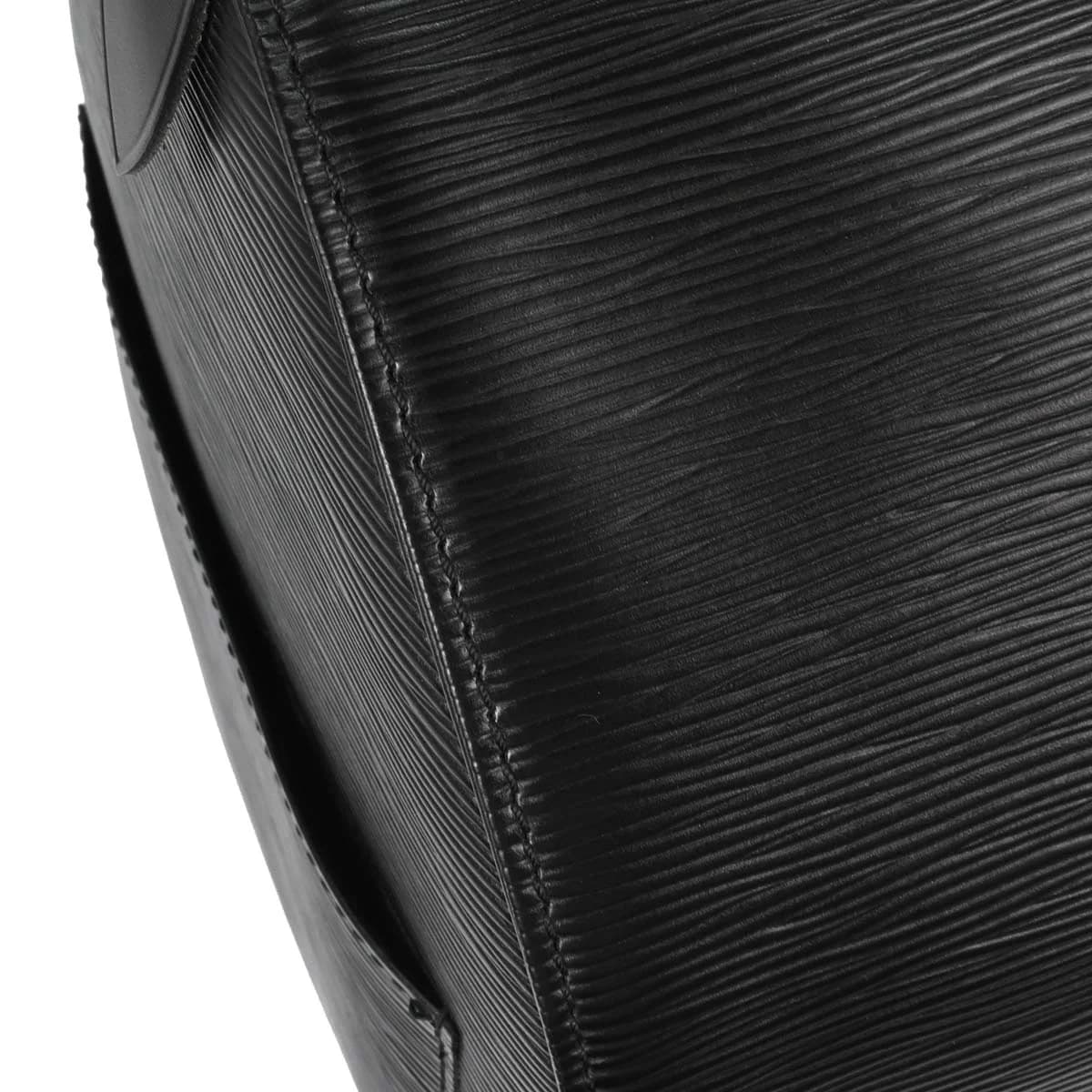 Large black textured-leather duffle bag with twin handles and a zip top.