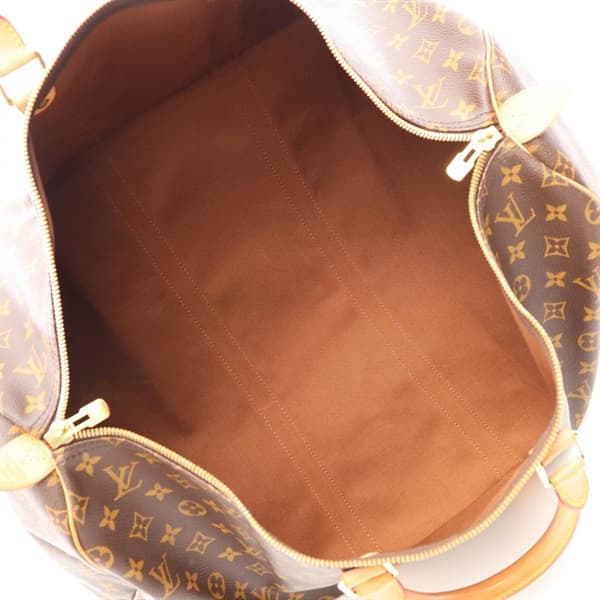 Brown monogram-canvas duffel bag with rolled leather handles and zip top.
