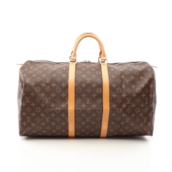 Brown monogram-canvas duffel bag with rolled leather handles and zip top.