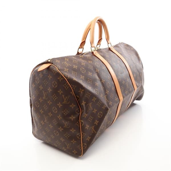 Brown monogram-canvas duffel bag with rolled leather handles and zip top.