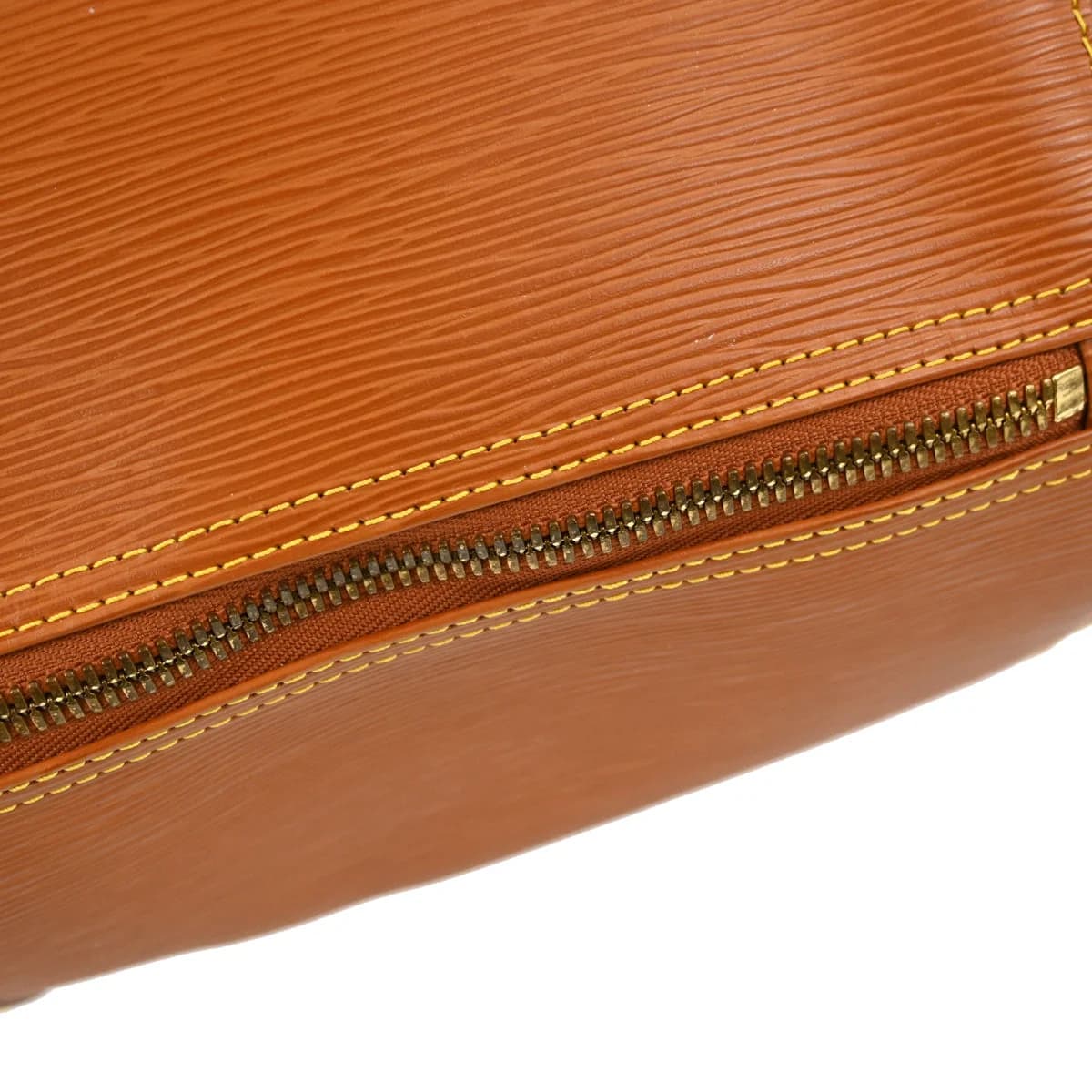 Brown textured leather holdall with twin handles, zip top and side pocket.