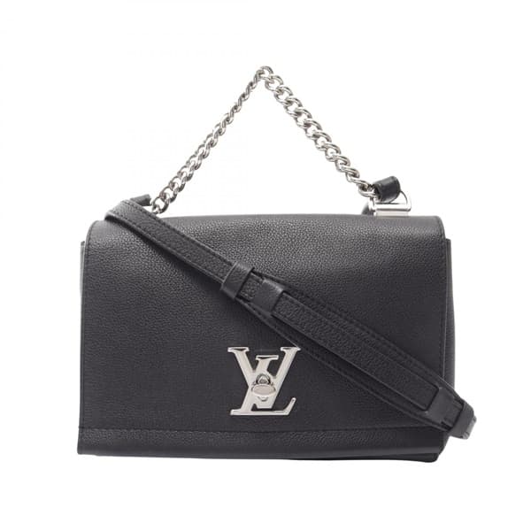 Compact black leather handbag with top handle and silver-tone twist lock.