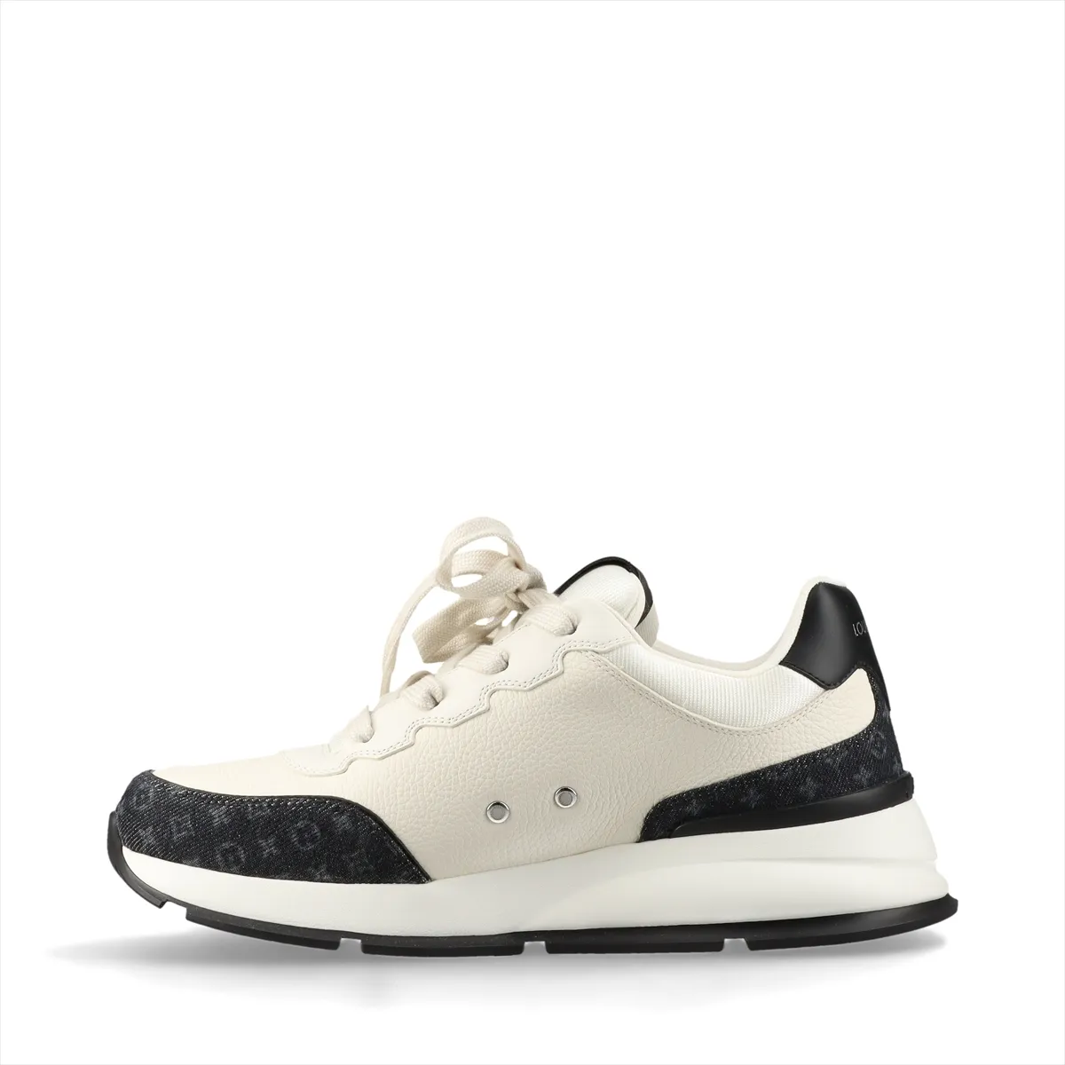 Black and ivory platform-soled sneakers in denim and leather with monogram patterning and a logo at the side.