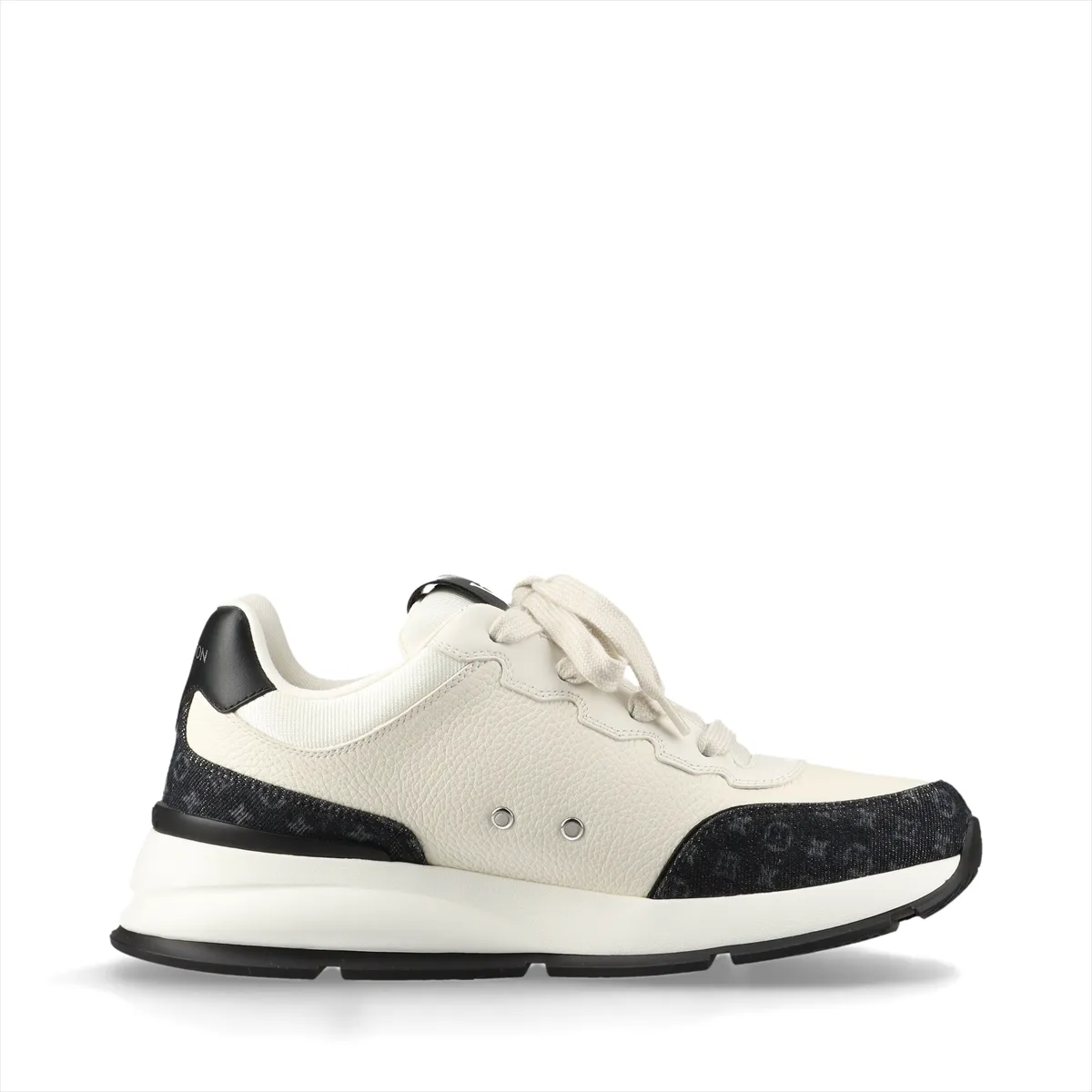 Black and ivory platform-soled sneakers in denim and leather with monogram patterning and a logo at the side.