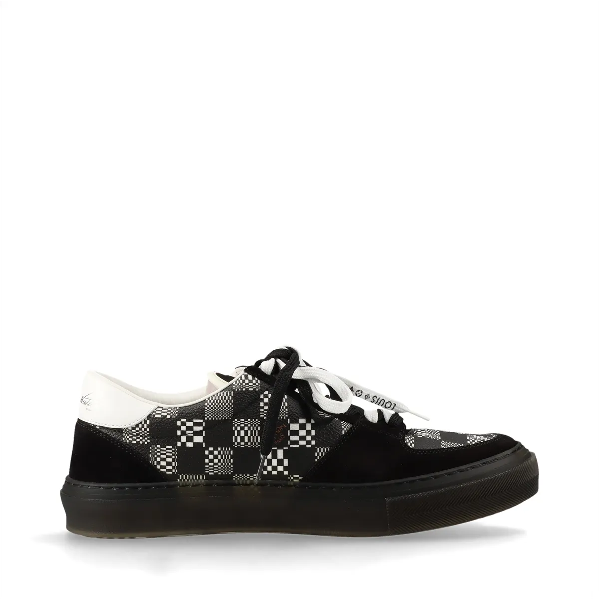 Black and white low-top sneakers with patterned panel detailing.