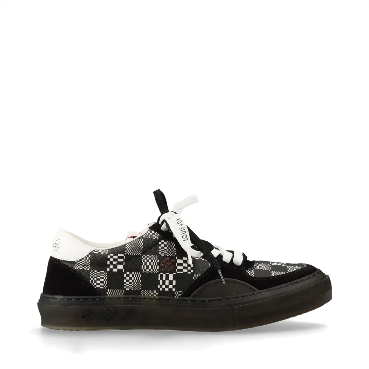 Black and white low-top sneakers with patterned panel detailing.