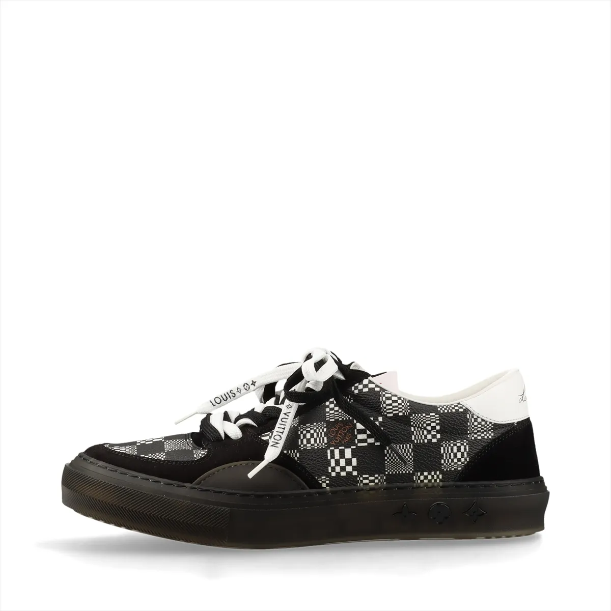 Black and white low-top sneakers with patterned panel detailing.